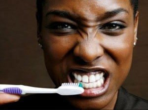 Should you brush your teeth at work - Photo credit: madamenoire.com