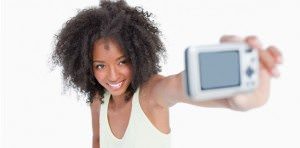 Is it ok to take selfies at work - Photo credit: uptown magazine.com