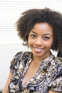 smiling young ethnic woman wearing headset