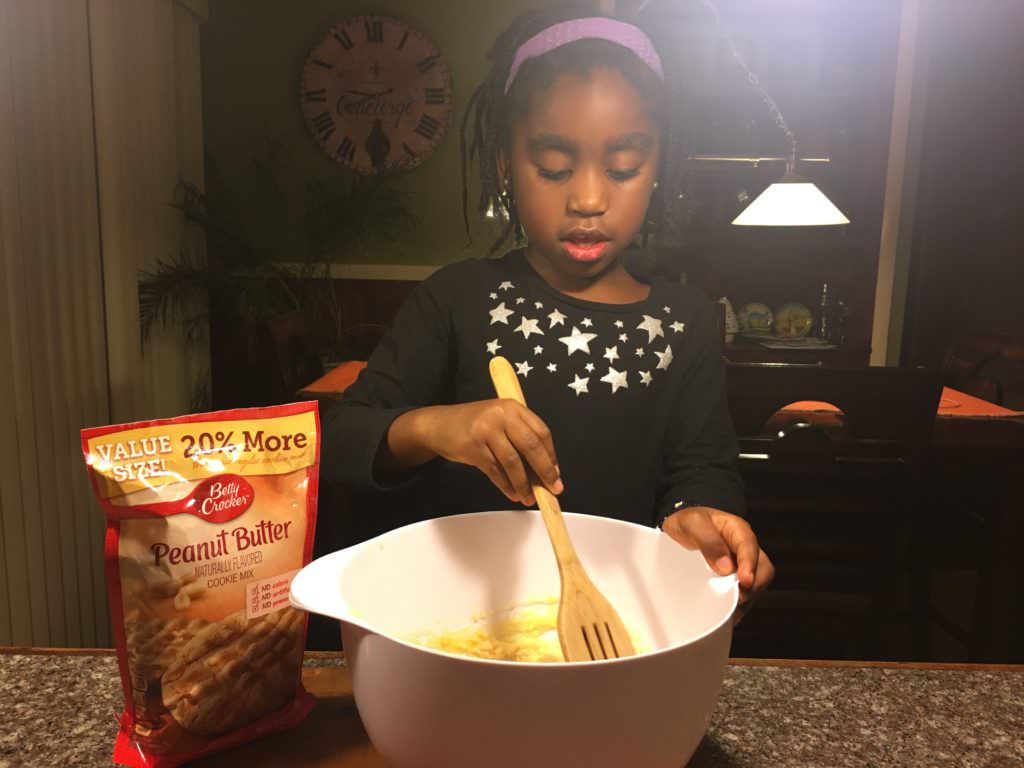My daughter enjoying mixing up a batch of Betty Crocker Sugar Cookie recipe